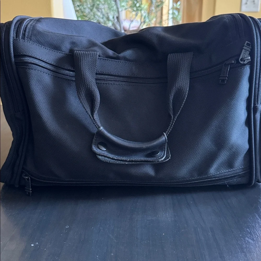 Tumi Black Men's Duffel with Red Logo Luggage Tag